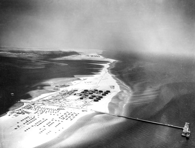 The refinery and pier at Ras Tanura was completed in 1945. Though its original output was 50,000 barrel per day, by 1952 its capacity had been expanded to 180,000 bpd