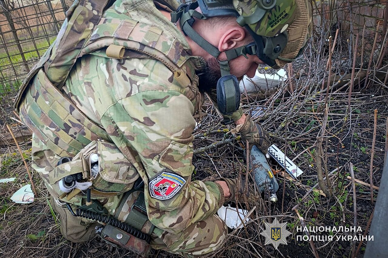 Police sapper with a 5-kg warhead of a downed Russian drone found on a field in Sumy region of Ukraine.
