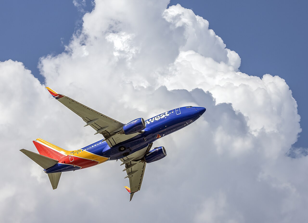 2010 Southwest Airlines Boeing 737-7H4 N947WN taking off at Baltimore-Washington International Thurgood Marshall Airport , Maryland, USA, in front of a cumulus congestus cloud
