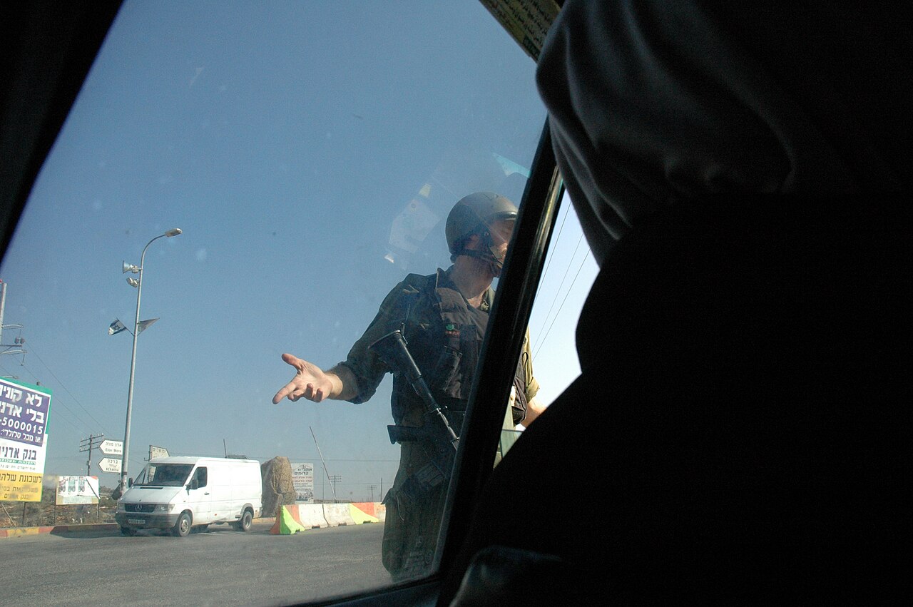 An Israeli soldier at a checkpoint in the West Bank. Huwwara Checkpoint