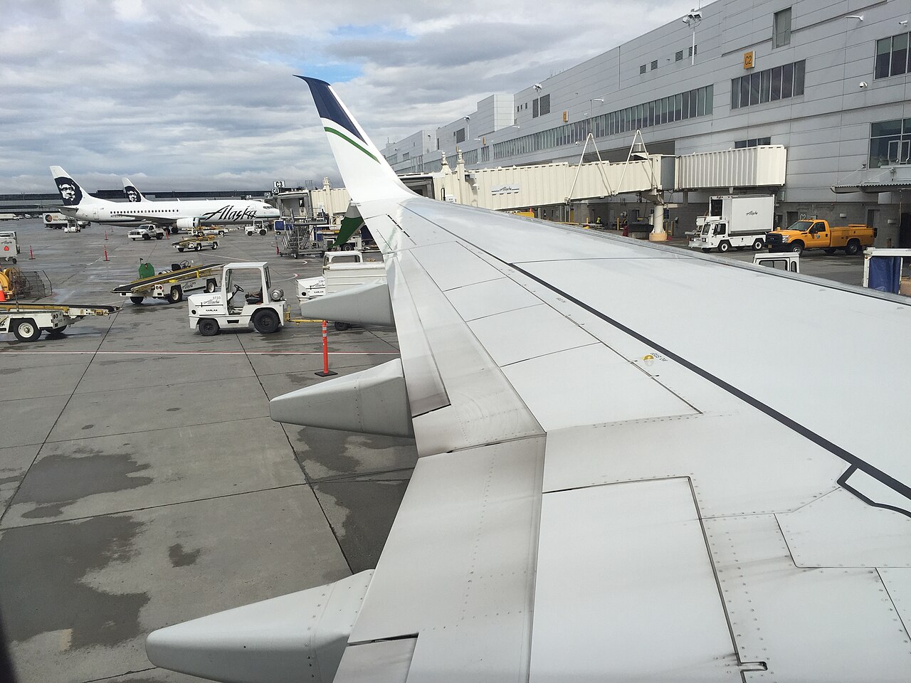 Alaska Airlines aircraft at Concourse C of the South Terminal, Ted Stevens Anchorage International Airport, Alaska, USA. Viewed from a Boeing 737-900ER registered N481AS.