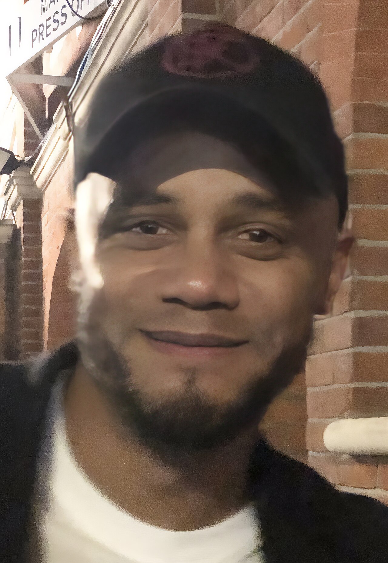 Vincent Kompany pictured with a fan after the match between Fulham and Burnley finished.