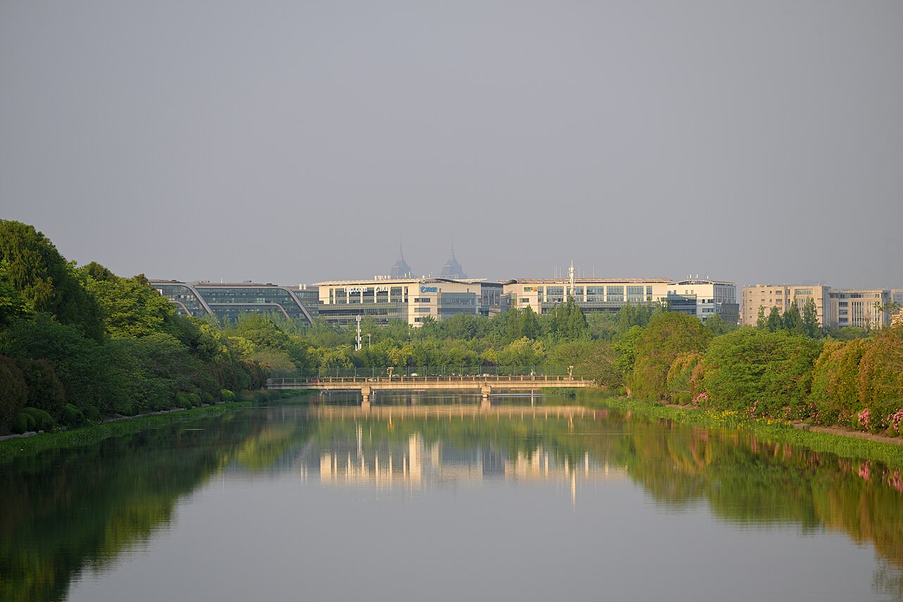 The headquarters building of Trip.com group in Shanghai, as seen from the Huajiang Highway bridge over Suzhou Creek.